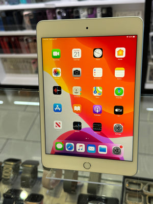 iPad with app icons displayed on a reflective surface