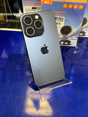Smartphone on a stand with a blue surface and product packaging in the background