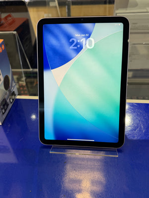 Tablet device with a blue and green screen on a reflective surface