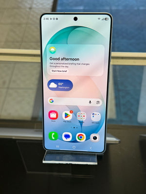 Smartphone on a stand with a reflective surface and blurred background