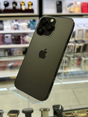 Black smartphone with Apple logo on a clear stand in a store setting