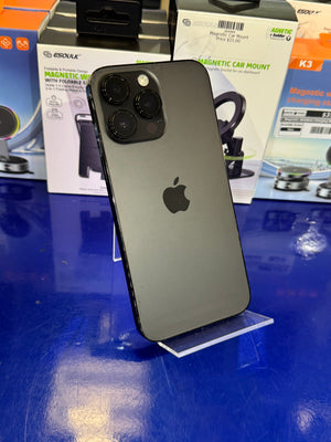 Black smartphone on a stand with magnetic car mount boxes in the background