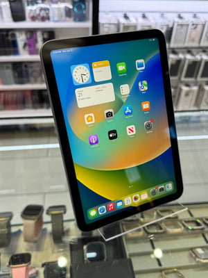 Tablet with a colorful display of app icons in a store setting
