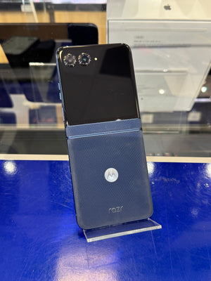 Motorola Razr phone on display with a blue back and silver logo.