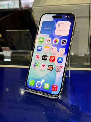 Smartphone with app icons displayed on a reflective surface