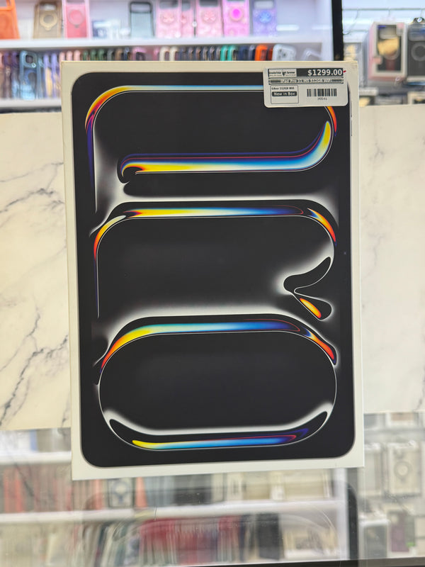 An iPad box photographed in a retail store setting.