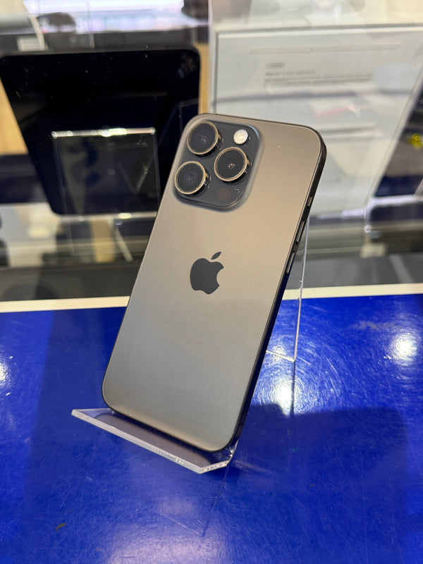 Smartphone with Apple logo on a reflective surface