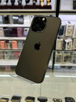 Black smartphone with Apple logo on a display stand in a store setting