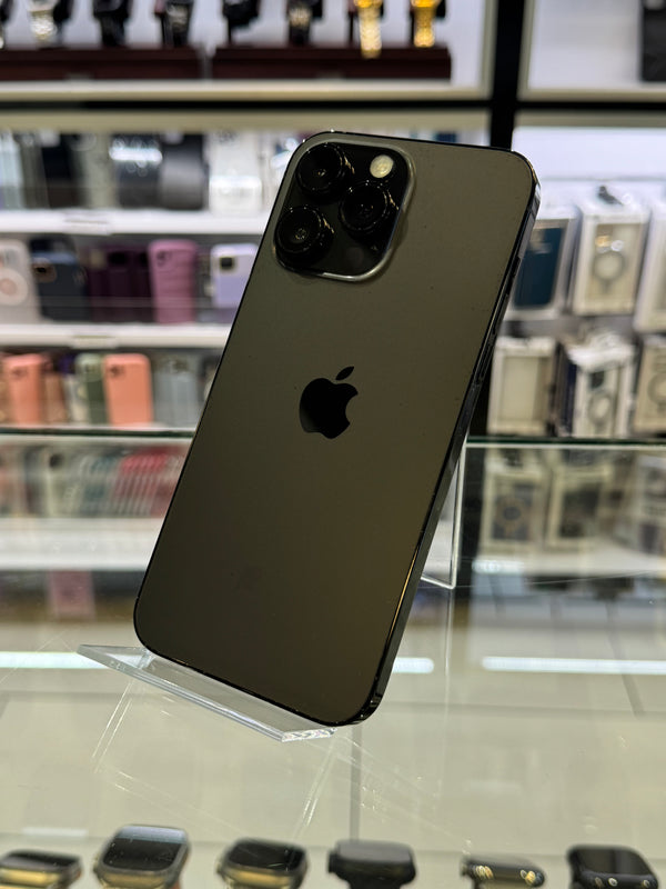 Black smartphone with Apple logo on a display stand in a store setting
