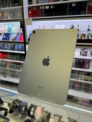 Apple iPad Pro with Apple logo on a blurred store shelf background