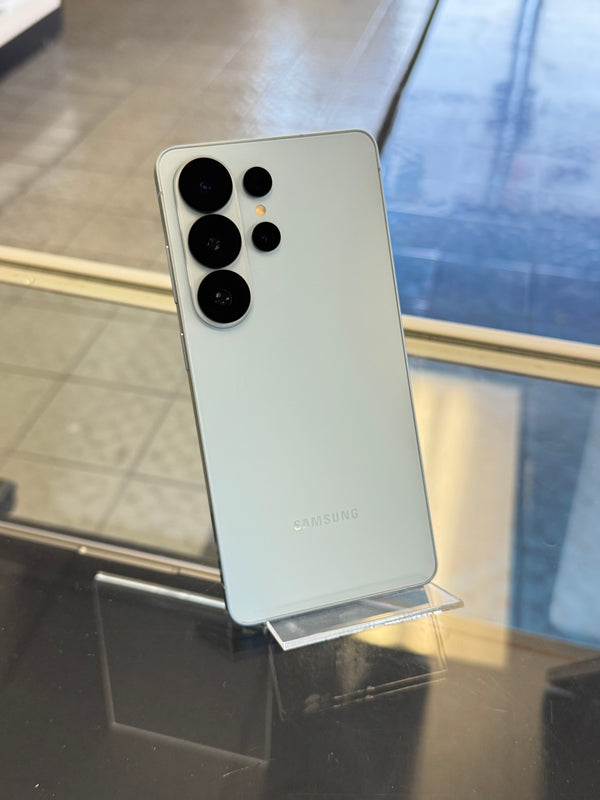 Samsung smartphone on a stand with a blurred background