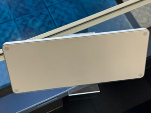 Back of an apple keyboard on a stand