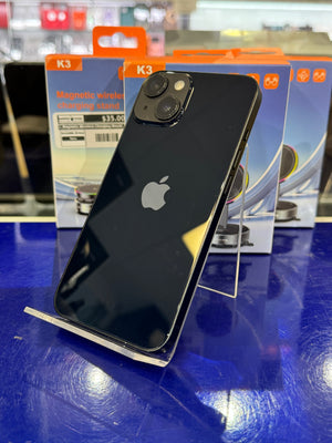 Black smartphone on a stand with a blurred background