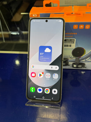 Smartphone on a stand with app icons displayed.