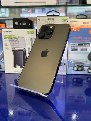 Smartphone on a stand with packaging in the background