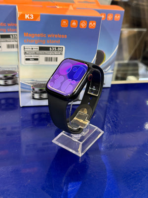 Smartwatch on a stand with packaging in the background