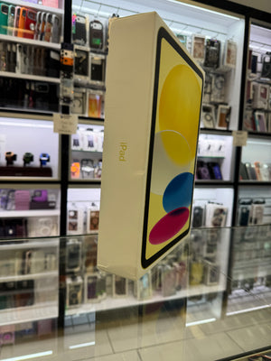 The side of an Apple iPad box displayed on a glass shelf in a store setting. 