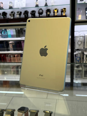 Gold iPad on display in a store with blurred background