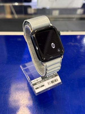 Smartwatch with a gray band on a blue surface