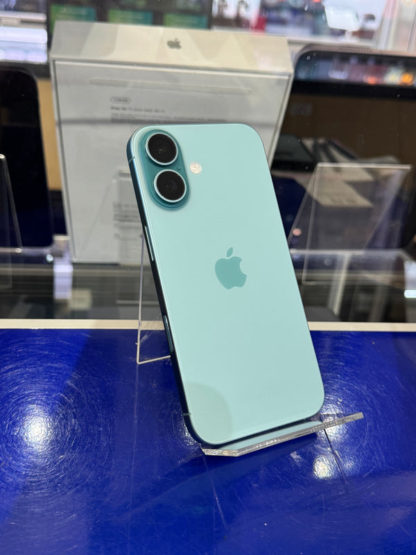 Green smartphone on a stand with an Apple logo in a store setting