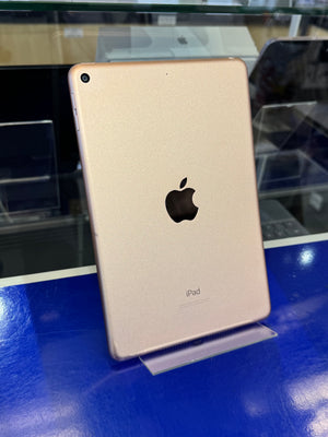 Gold iPad on a stand with a blurred background