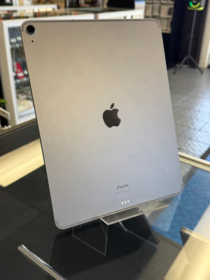 Silver iPad Air on a stand with Apple logo in a store setting