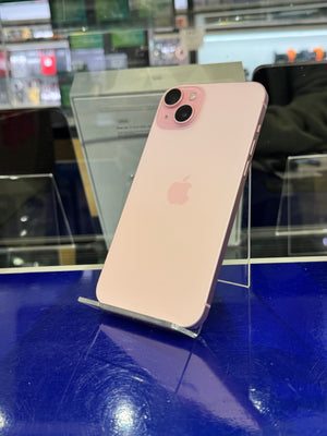 Pink iPhone on display with a blurred background