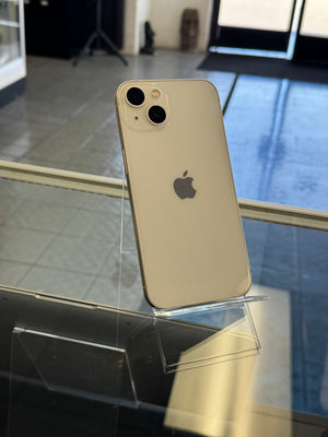 Silver iPhone 11 on a stand with blurred background