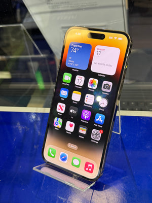 Smartphone with app icons displayed on a blue surface