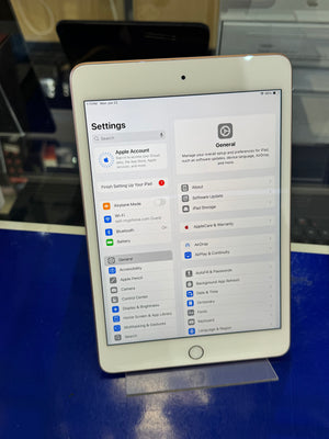 White tablet with settings app open on a blue surface