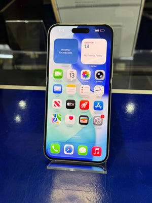 Smartphone with app icons displayed on a reflective surface