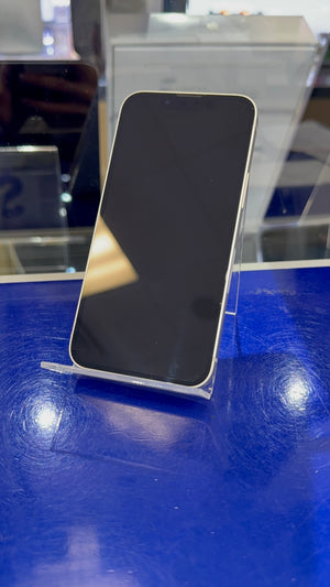 Smartphone on a stand with a blue surface and reflective background