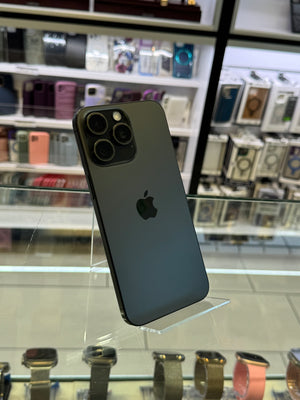 Black smartphone with Apple logo on a reflective surface