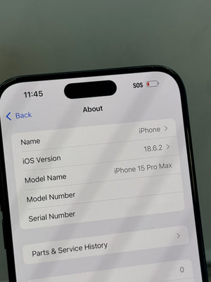 Close-up of an iPhone screen showing the 'About' screen with model name 'iPhone 15 Pro Max' and iOS version 18.6.