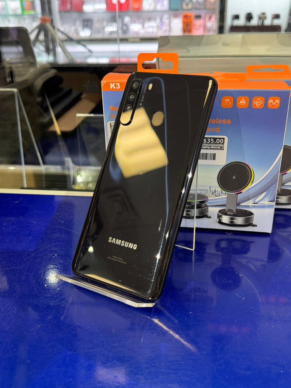Samsung phone on a blue surface with a blurred background