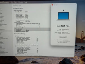 A screenshot of a MacBook Neo battery information panel on a computer desktop, with a battery icon and product details visible. The desktop background shows a blurred outdoor scene.