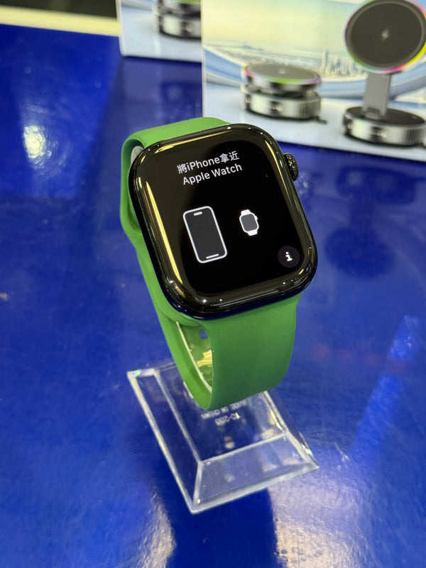 Smartwatch with a green band on a stand