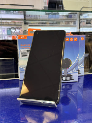 Smartphone on a stand on a blue background