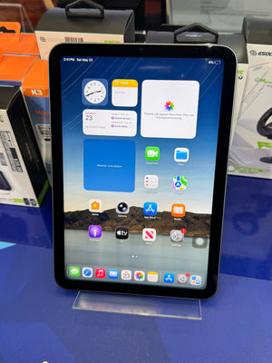 Tablet with app icons on a blue surface
