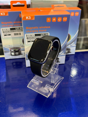 Black Apple watch on a clear stand with K3 packaging in the background.