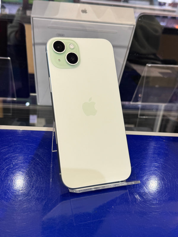 Green smartphone on a stand with a blurred background