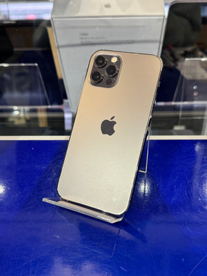 Gold iPhone on a stand with an Apple logo against a blue surface