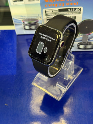 Black Apple watch on a blue surface