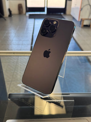 Black smartphone with Apple logo on a reflective surface