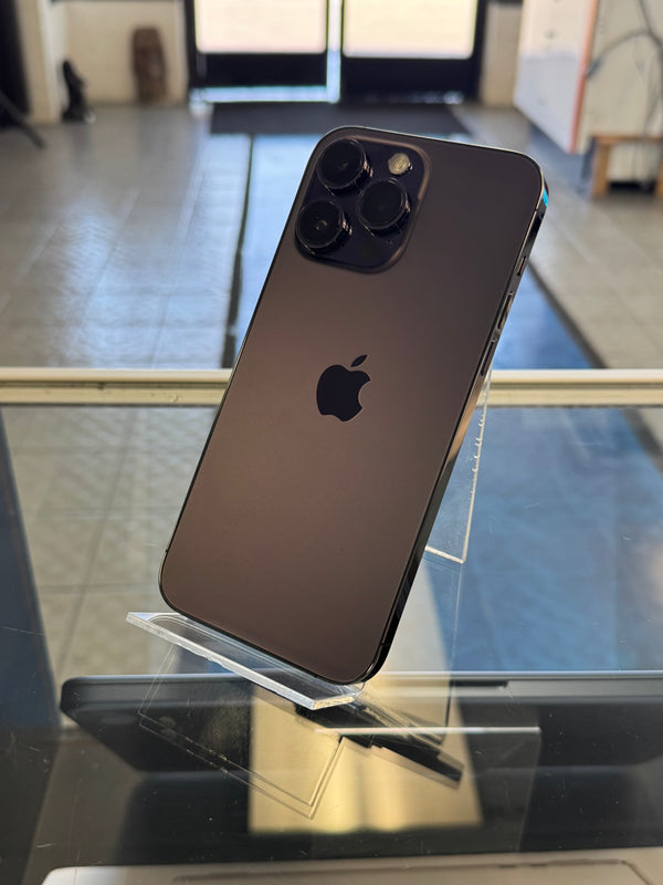 Black smartphone with Apple logo on a reflective surface