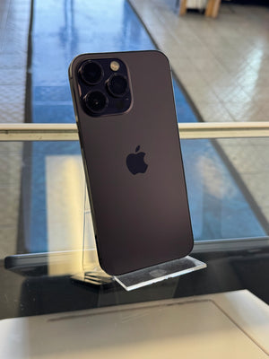 Black smartphone with Apple logo on a reflective surface
