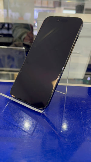 Black smartphone on a blue surface with a blurred background