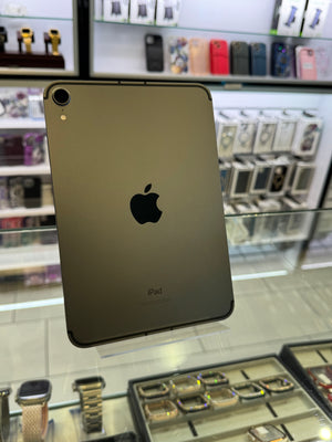 Gold Apple iPad Pro with Apple logo on a reflective surface