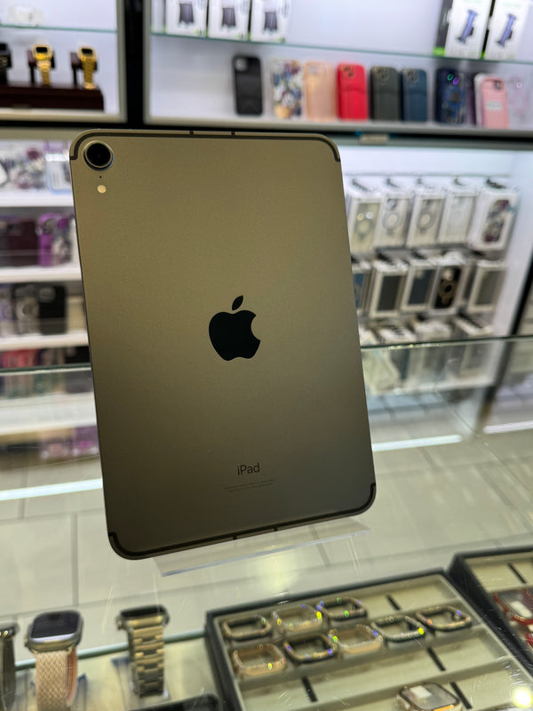 Gold Apple iPad Pro with Apple logo on a reflective surface