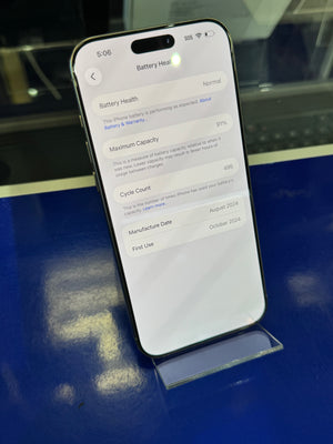 Smartphone on a reflective surface with a blurred background